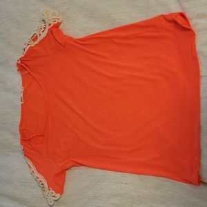 Bright  coral shirt with lace detail on the shoulders